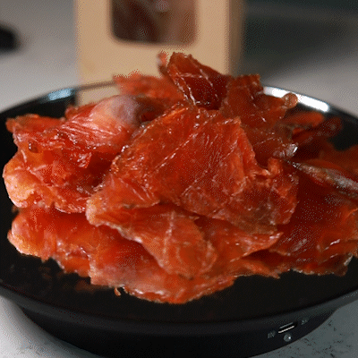 The pieces of steelhead trout with red meat, rolled in honey